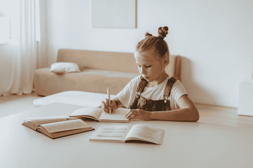 Girl writing in a book